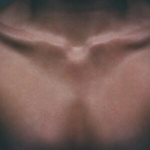 a close up of a man's chest with no shirt on